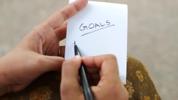 Women Hand Writing New Year Goals Notepad Table — Stock Video