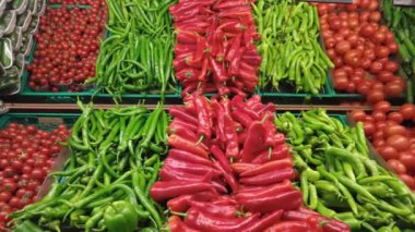  green and red capsicum displaying at shop .