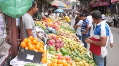 customer buying fruits at local market 