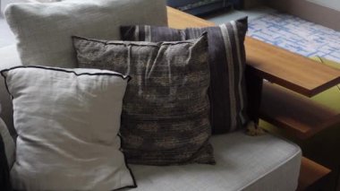 modern grey sofa with pillows in living room at home. High quality photo