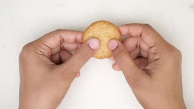  slow motion of breaking sweet cookies .