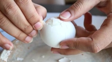 women hand perfectly Peeled Boiled Eggs .