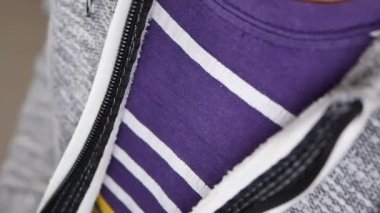 Man zipper on a jacket in cold autumn day. .