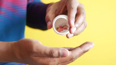 young men taking medical pill .