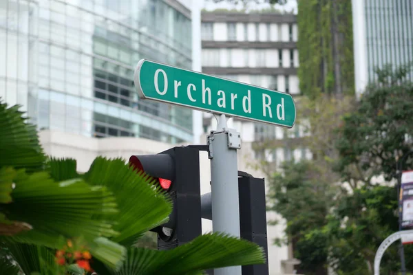 orchard road signn and buildings .