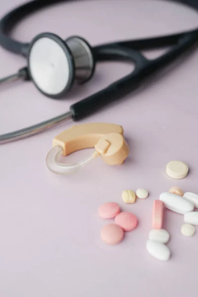 stock image Hearing aid equipment on table close up .