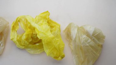 hand pick plastic bag on table
