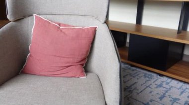 modern grey sofa with pillows in living room at home. High quality photo