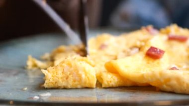 women eating Plain Egg Omelette,