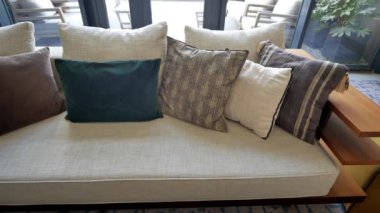 modern grey sofa with pillows in living room at home. High quality photo