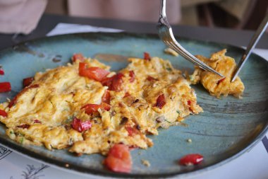 women eating Plain Egg Omelette,