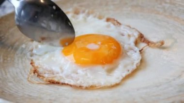 Fried eggs in the plate close up ,,