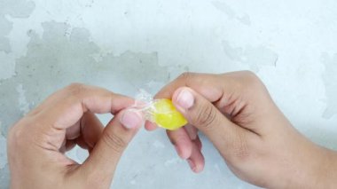 removing packet from a chocolate .