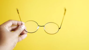 men holding a old eyeglass ,