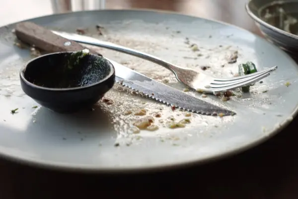 stock image Empty plate after eating on table ,