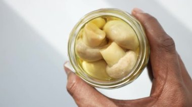  top view of Canned mushrooms on table .