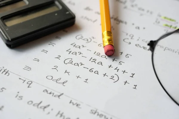 stock image Hand writing algebra equations on a paper .