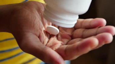 young men taking medical pill .