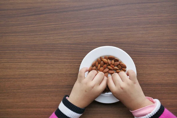 Child Hand Pick Almond Nuts — Stock Photo, Image