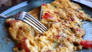 women eating Plain Egg Omelette,