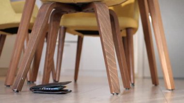  left wallet on floor at home .