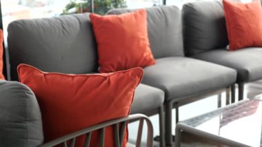 modern grey sofa with pillows in living room at home. High quality photo