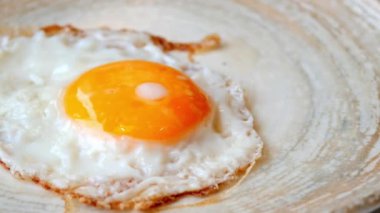 Fried eggs in the plate close up ,,