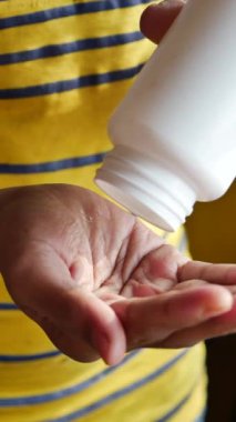 young men taking medical pill .