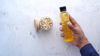 peanuts and oils in a container ,