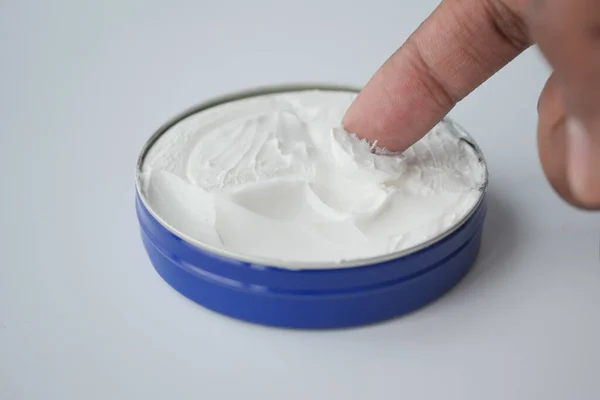 stock image  man applying beauty cream onto skin .