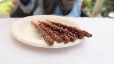 almond nut dark chocolate stick on table .