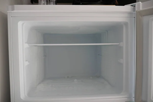 stock image open empty fridge at home .