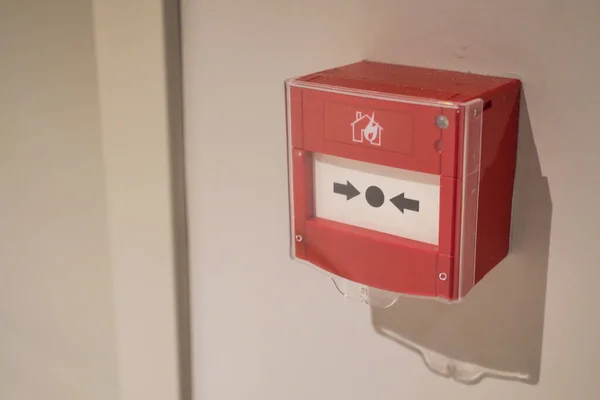 stock image Red fire alarm button on wall 