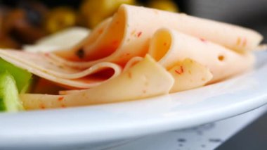 salami sausage cut into thin pieces .