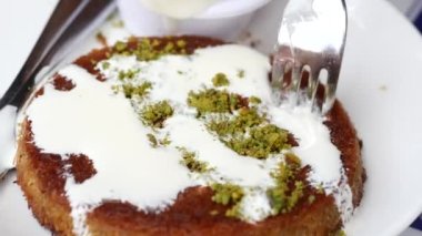 kunafa with a wipe cream on a plate