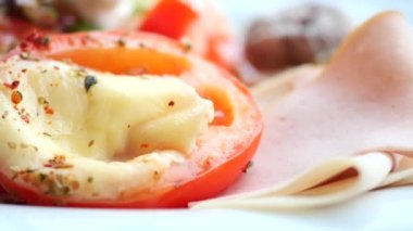 Tomatoes stuffed with cheese from the oven.