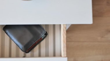 men stealing wallet from a drawer ,