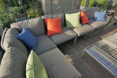 modern grey sofa with pillows in living room at home. High quality photo