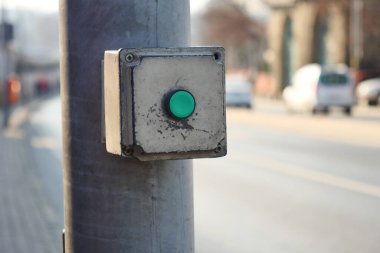 close up of crossing signal button in singapore .