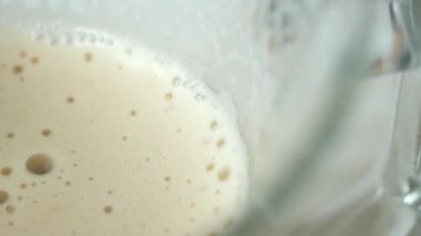 top view of hot coffee with bubble on white background ,