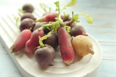 Fresh red radish bundle on table . High quality photo