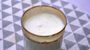 glass of whole cream milk on table , 
