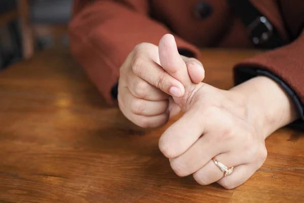 stock image  Young women suffering pain in finger .