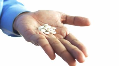 young men taking medical pill .