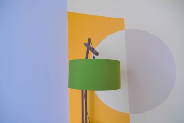 a lamp in home against white wall .