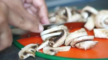 Fresh champignons mushroom in a white bowl on table ,