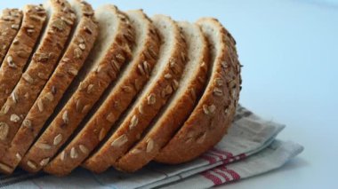 close up of slice of whole grain bread .