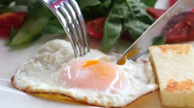 Fried eggs in the plate close up ,,