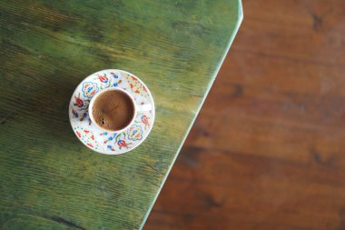 a cup of turkish coffee on table outdoor ,