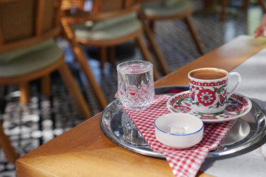 a cup of turkish coffee on table outdoor ,